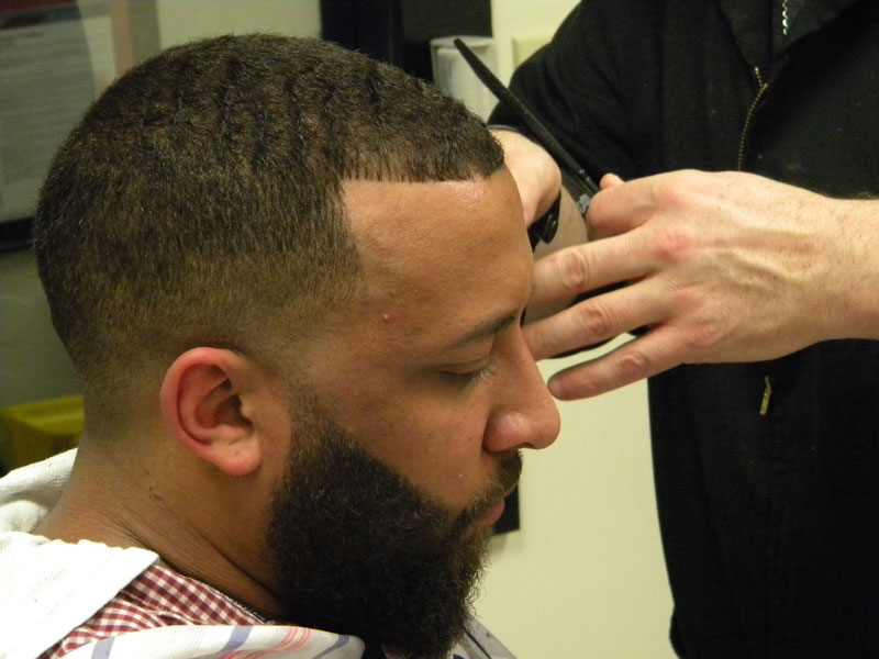 haircut photo of barber trimming beard